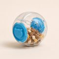 Blue interactive pet treat tumbler toy with mixed treat pieces